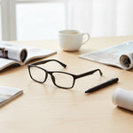 Black eyeglasses on table