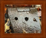 Rusty metal hinge with holes, surrounded by autumn leaves, framed print