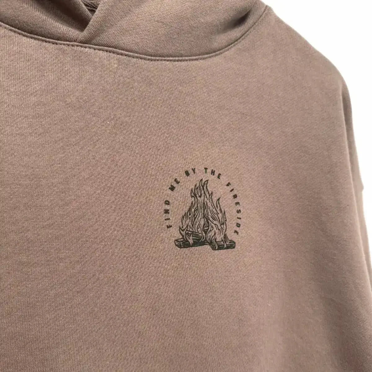 Tan hoodie with 'Find Me By The Fireside' campfire graphic print