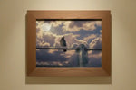 Framed print of a bird perched on a fence against a cloudy sky with moon, natural world artwork