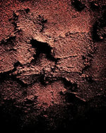 Rustic textured wall with deep red and black tones, abstract art print