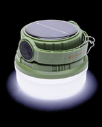 Green camping lantern with solar panel on a black background