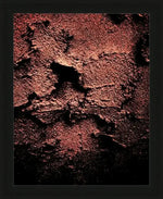 Textured abstract artwork in deep red and black, framed in black, suitable for modern wall decor.