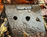 Rusty metal hinge with water droplets among autumn leaves, natural texture photography