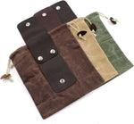 Waxed canvas drawstring bags with leather accents in brown, tan, and green, featuring metal snap closures.