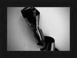 Black and white abstract art print of a metallic object, framed in USA-made frame