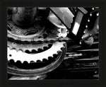 Black and white close-up of bicycle chain and gears, mechanical detail photography