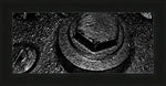 Black and white close-up of textured metal bolt and nut, framed print with USA-made frame