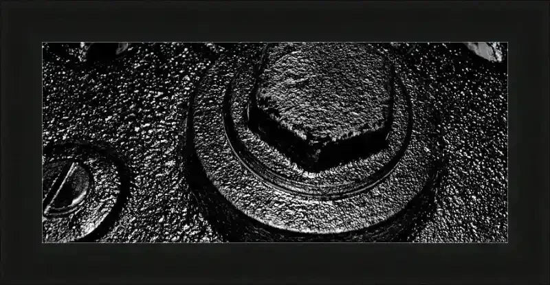 Black and white close-up of textured metal bolt and nut, framed print with USA-made frame
