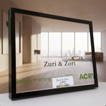 Framed picture with Zuri & Zori branding on a green wall background