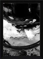 Snow-covered bicycle gear and chain in black and white, framed print