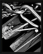 Black and white framed print of rustic metal chain links and weathered wood texture