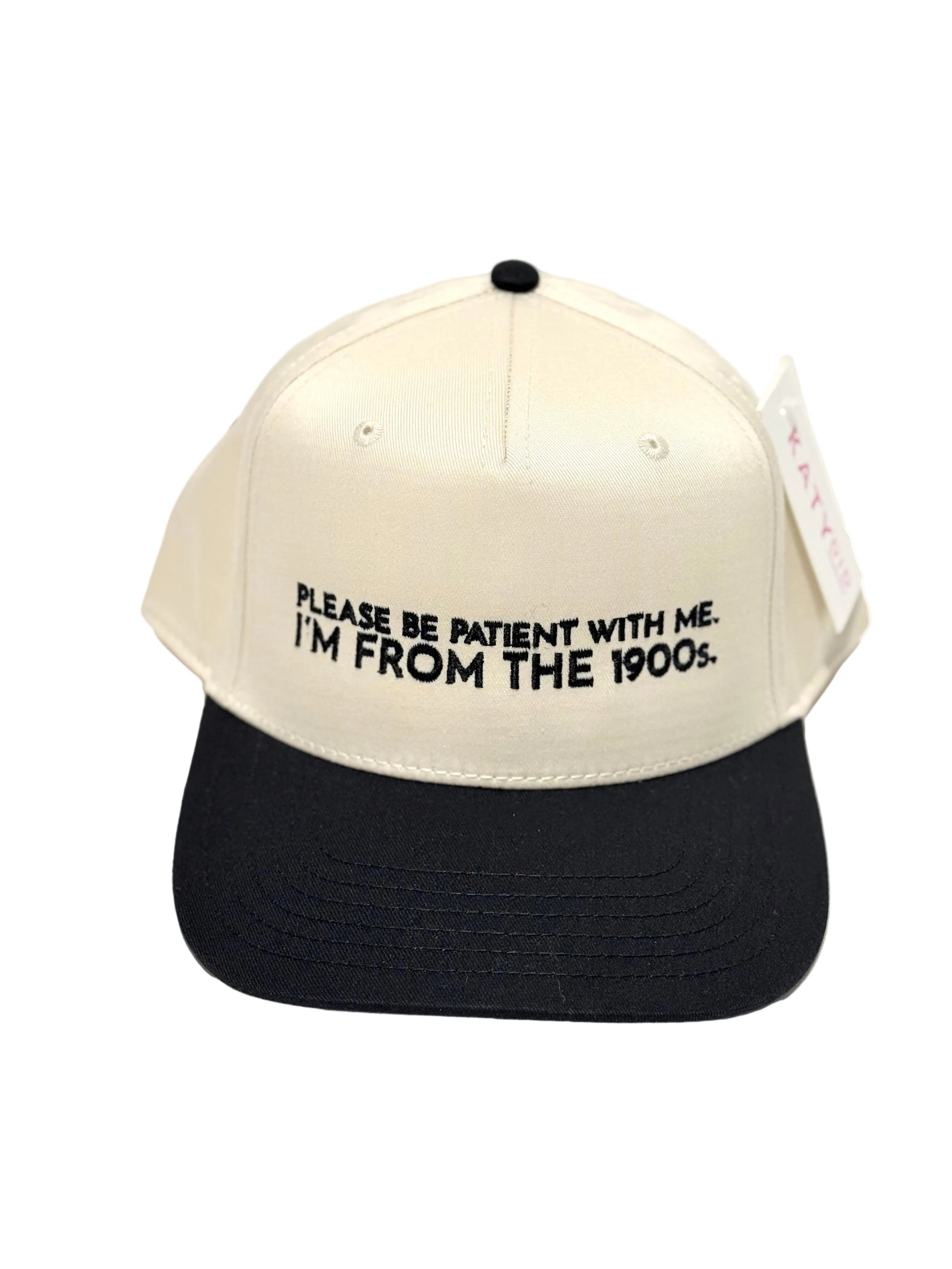 Trucker hat with text 'Please be patient with me. I'm from the 1900s.' on a white background