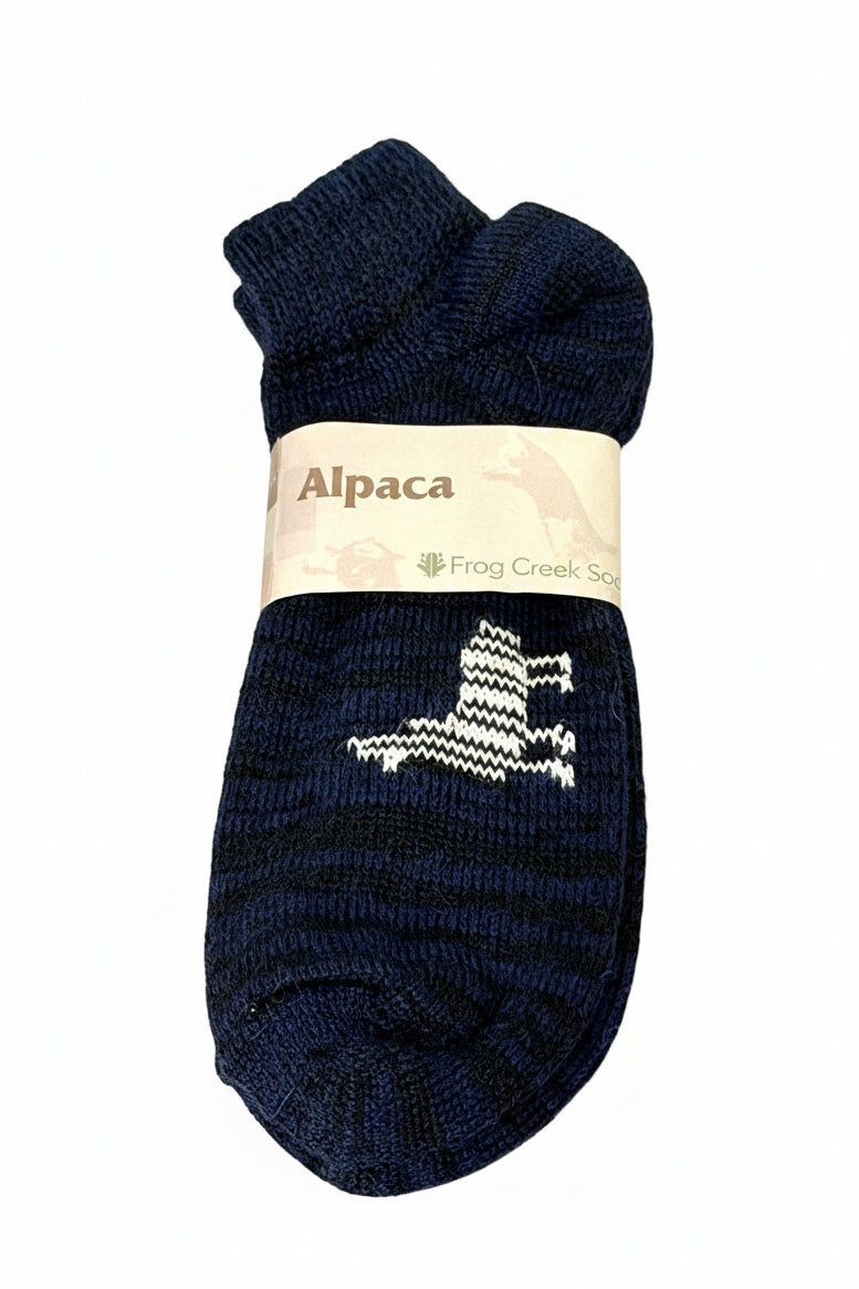 Pair of navy blue alpaca socks with a visible brand label on a white background
