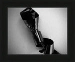 Black and white abstract photo of crumpled reflective material in a frame