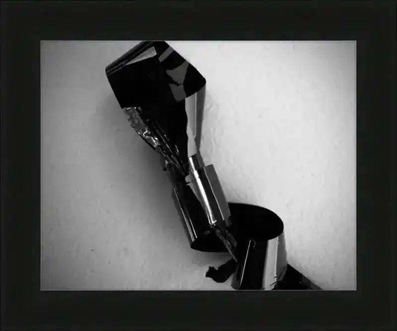 Black and white abstract photo of crumpled reflective material in a frame