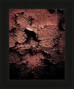Textured abstract artwork in deep red and black, framed in black wood, ideal for modern wall decor.