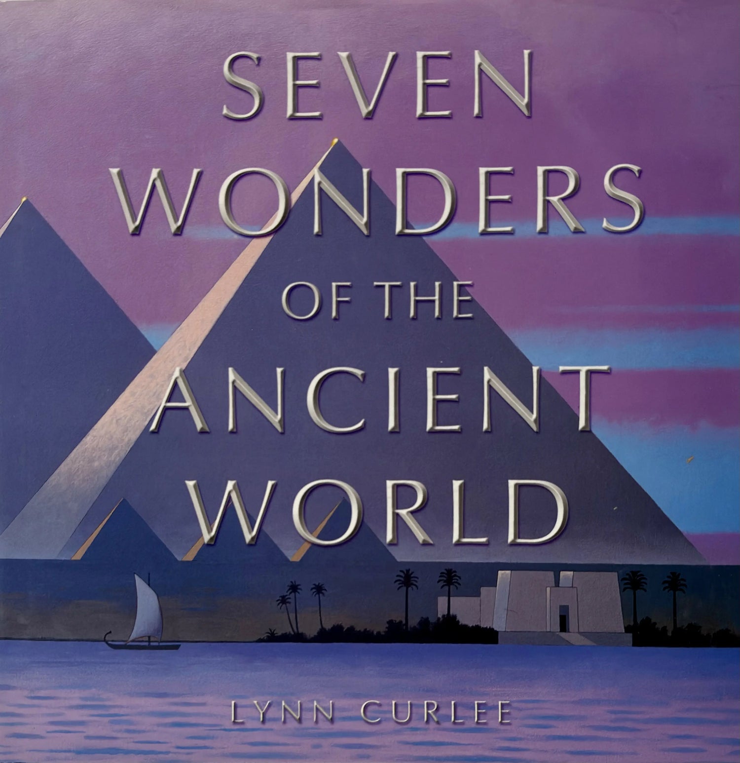 Book cover of 'Seven Wonders of the Ancient World' with pyramids and a sailboat.
