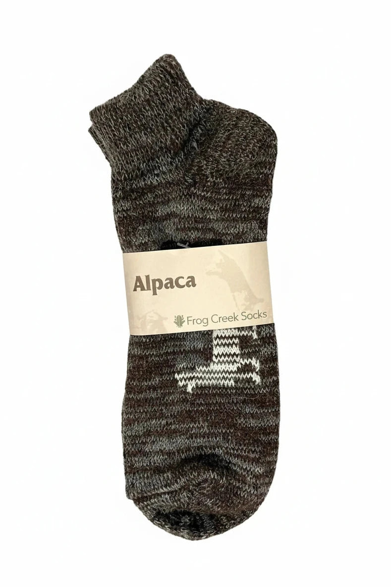 Alpaca socks with white pattern, labeled Frog Creek Socks, on white background