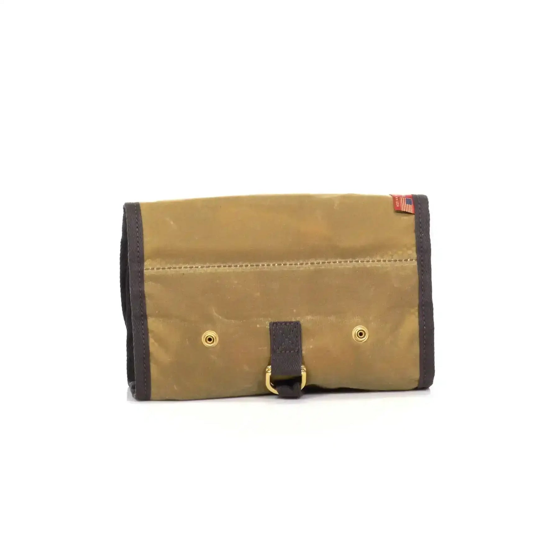 Tan waxed canvas roll-up pouch with dark brown trim, brass grommets, and leather strap closure, USA flag tag.