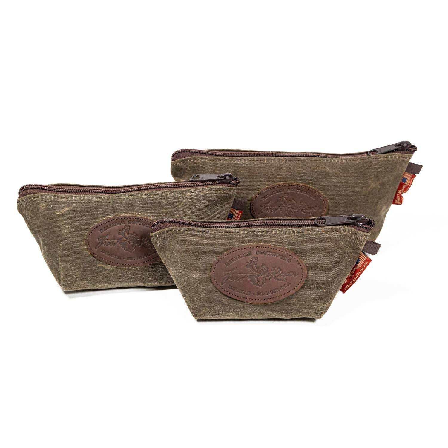 Three olive green waxed canvas zip pouches with leather patches, made in USA