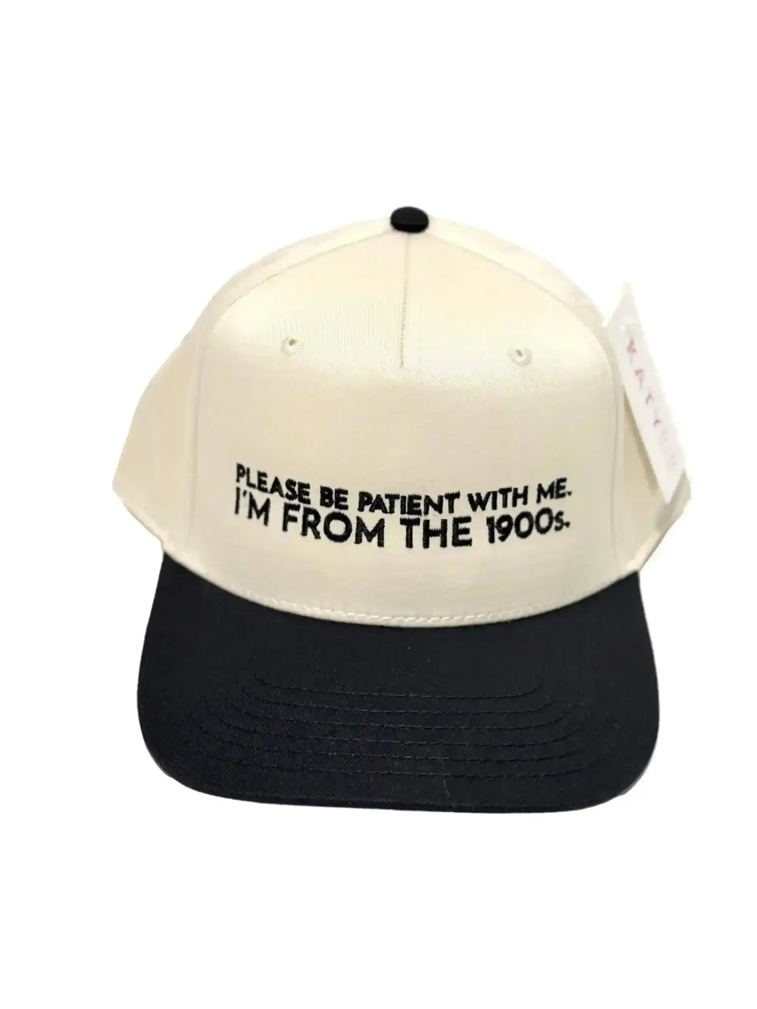Cream and black trucker hat with embroidered text 'Please be patient with me. I'm from the 1900s.'
