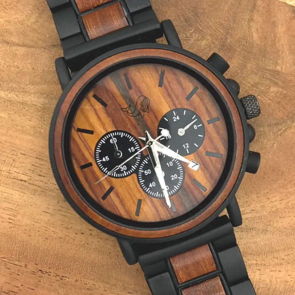 Wooden watch with black metal strap on a wooden surface