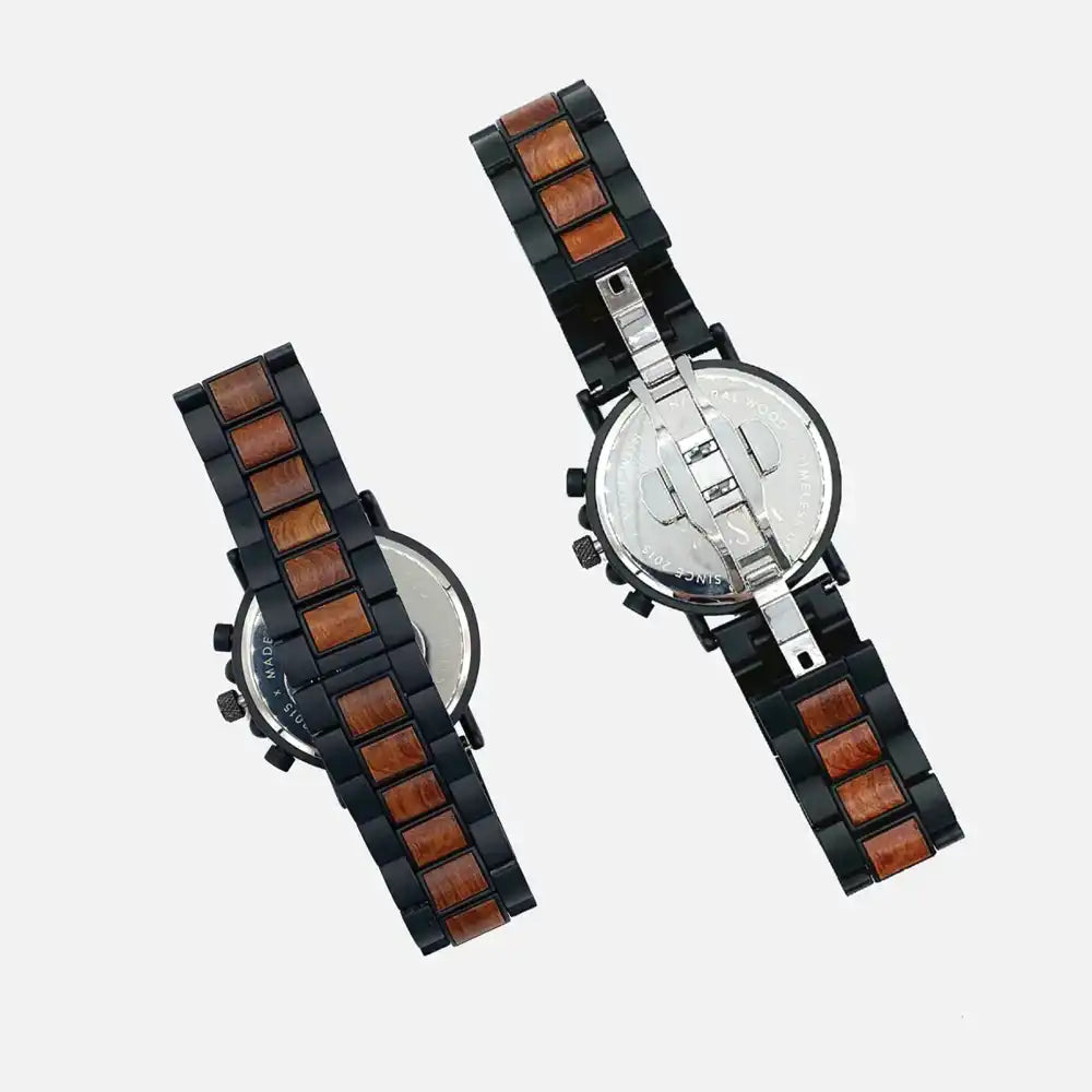 Two watches with wooden and black straps on a light gray background