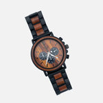 Wooden watch with black metal strap on a white background