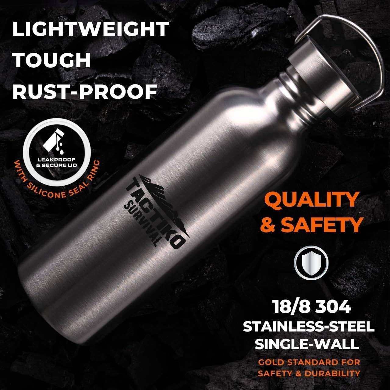 Stainless steel water bottle with Tagtiko Survival logo, lightweight and rust-proof, set on dark rocks