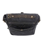 Black leather bag with brass hardware on a white background