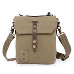Beige canvas crossbody bag with leather accents on a white background