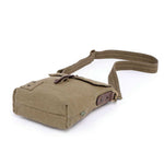 bottom view of a Brown leather bag with a strap on a white background