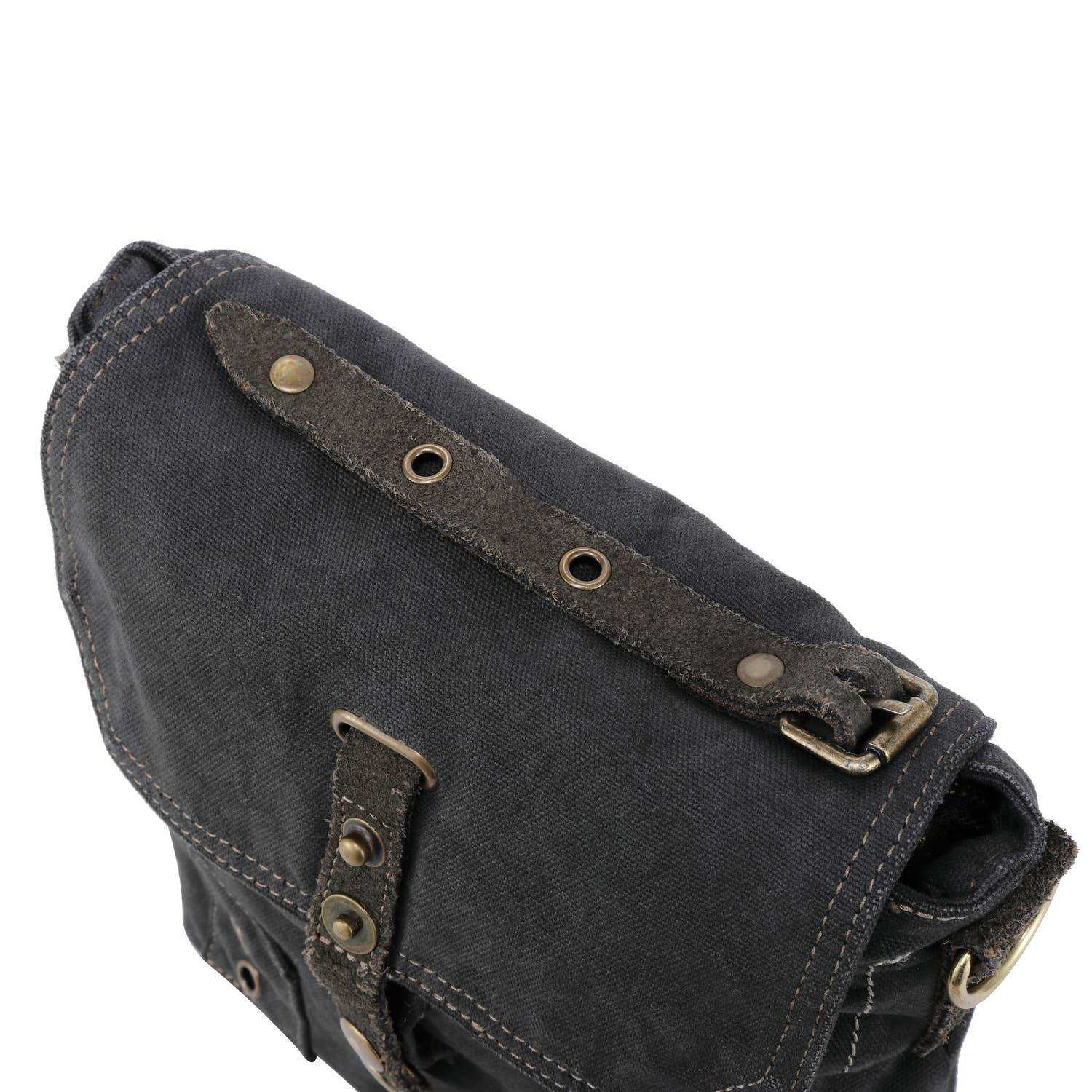 Dark gray leather bag with brass hardware on a white background