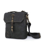 Black leather backpack with a strap on a white background