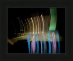 Abstract night light trails in colorful streaks, framed print with motion blur effect