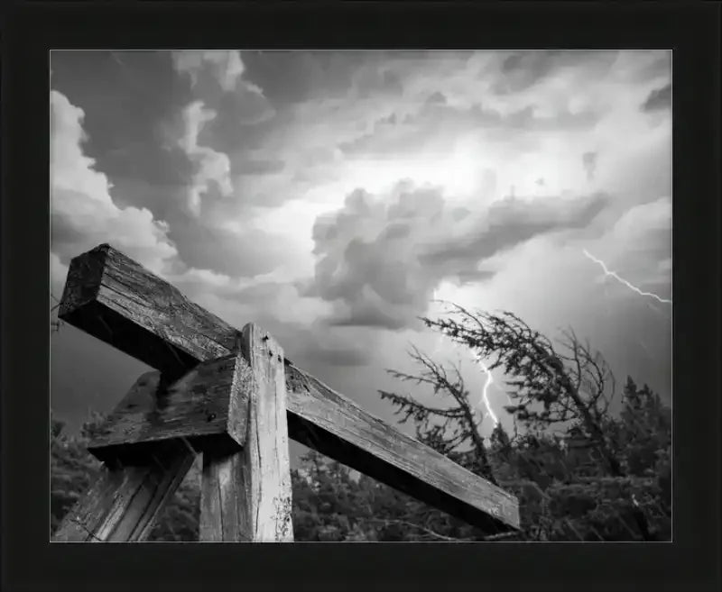 Dramatic black and white storm sky with lightning over rustic wooden beam, framed print