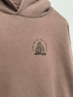 Tan hoodie with 'Find Me By The Fireside' campfire graphic print, cozy outdoor apparel