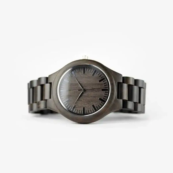 Dark wood grain watch with minimalist black dial and linked band on white background