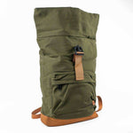 Olive green roll-top backpack with tan straps and base, featuring front pocket and buckle closure