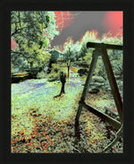 Framed surreal nature print with vibrant colors, wooden swing, and house in forest setting