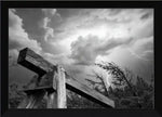 Black and white framed print of rustic wooden beam under stormy sky with lightning