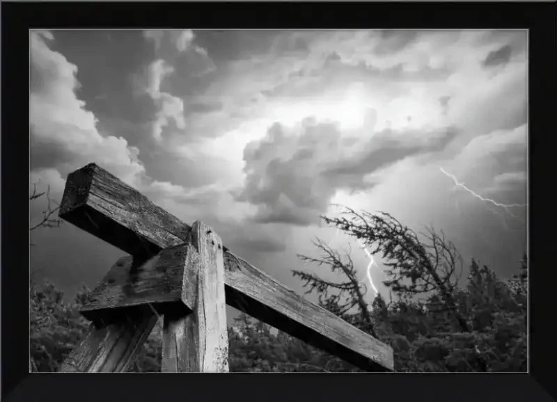Black and white framed print of rustic wooden beam under stormy sky with lightning