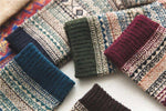 Cozy knit socks with geometric patterns in earthy tones, perfect for autumn and winter wear.