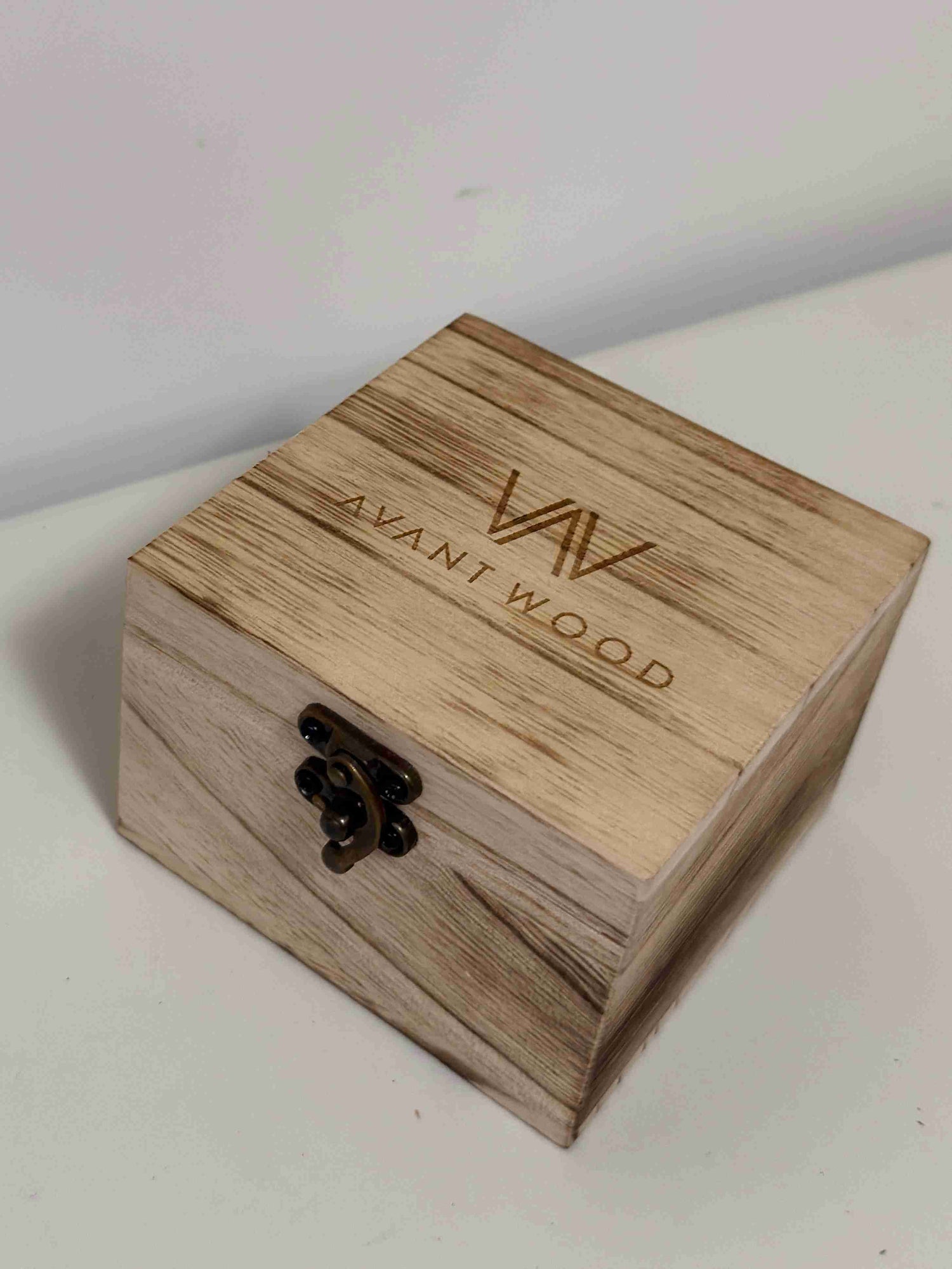 Wooden box with 'AVANT WOOD' branding on a light background