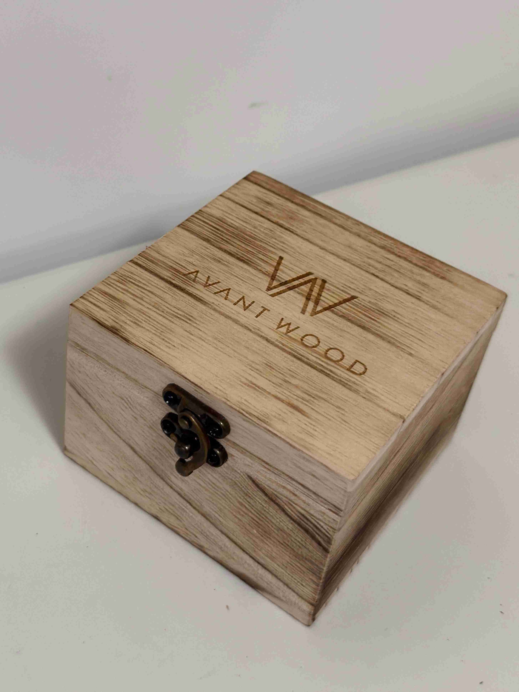 Wooden box with 'AVANT WOOD' branding on a light background